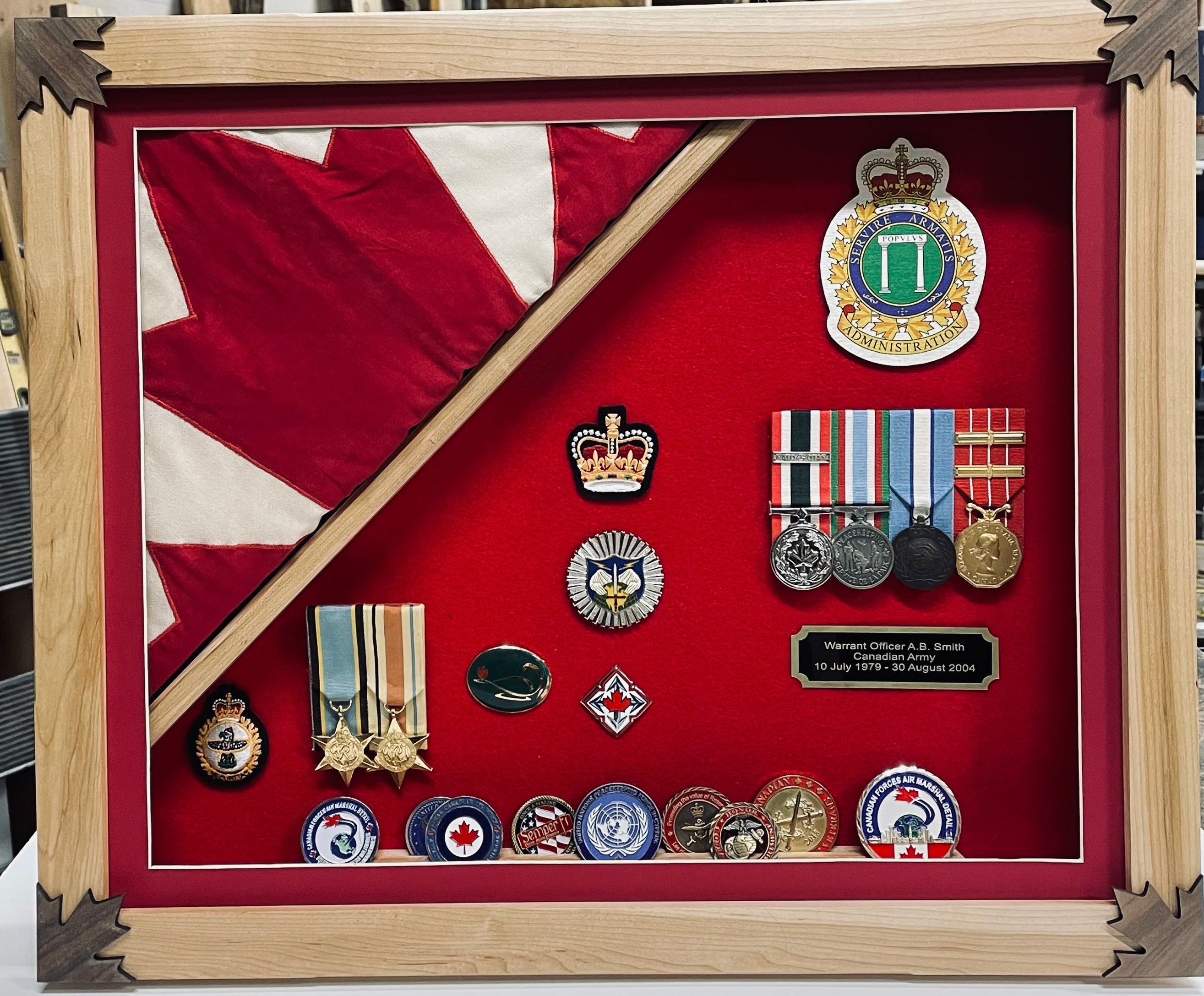 Popular shadow box models featuring medals, badges, and a Canadian flag display.
