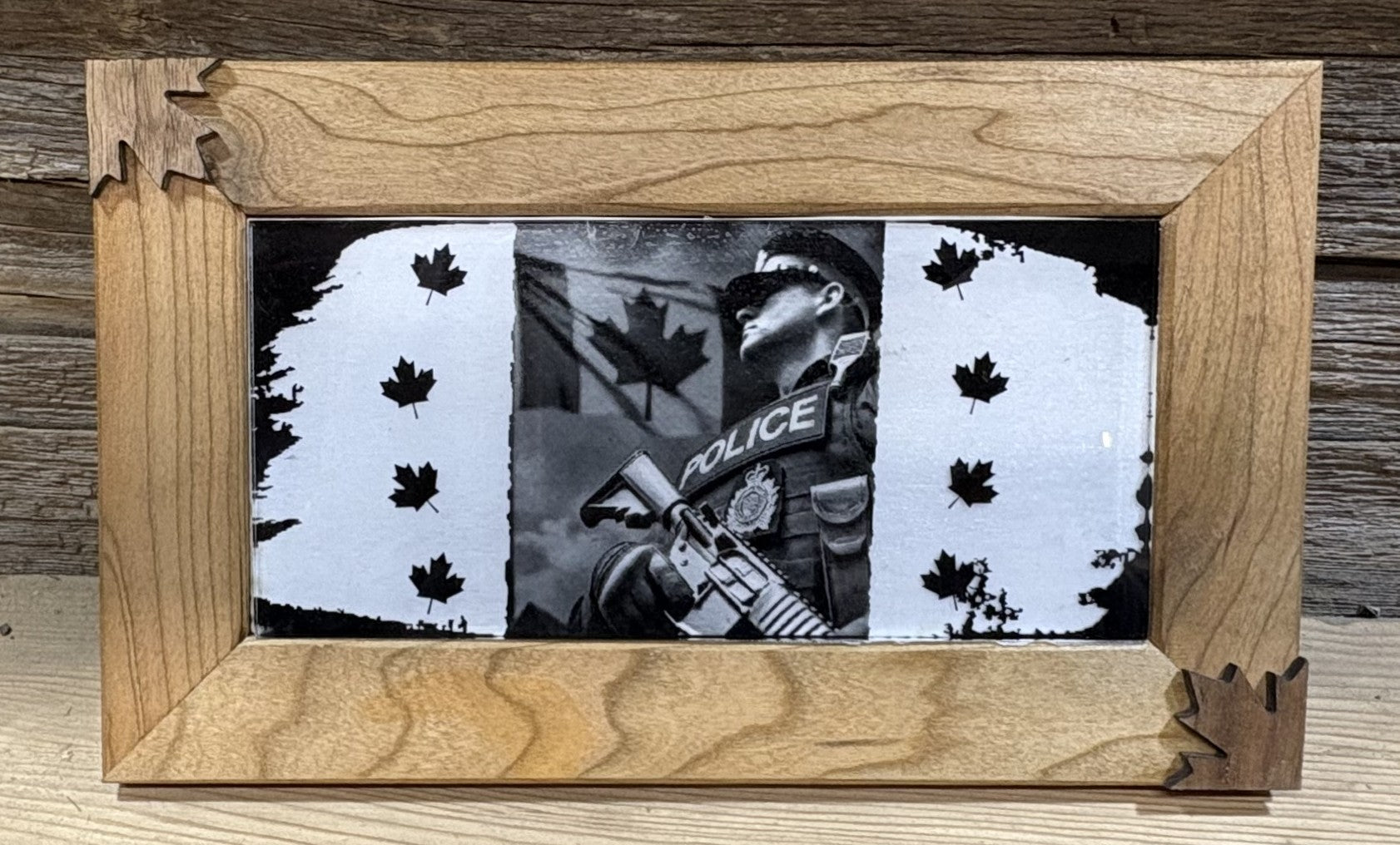 Canadian products collection showcasing a framed image of a police officer with Canadian flags.
