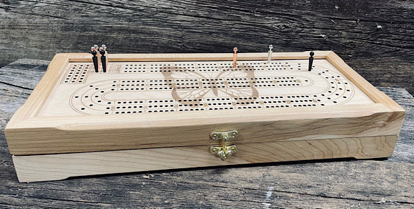 Wooden cribbage board featuring pegs and a butterfly design, ideal for classic tabletop gaming.