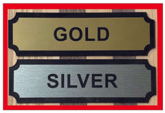 Gold and Silver nameplates displayed on a wooden background, showcasing elegant finishes for labels or markers.
