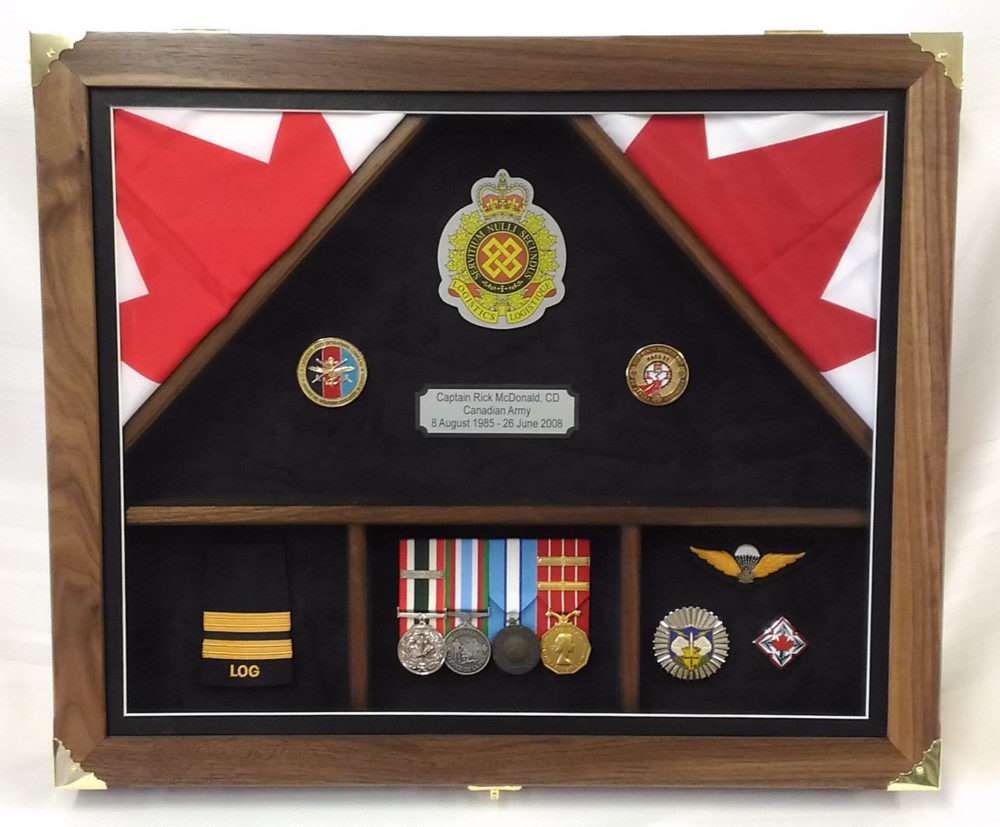 Custom engraved plaque commemorating military achievements with flags and medals.