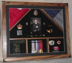 Custom engraved plaque honoring military service with photo and medals display.
