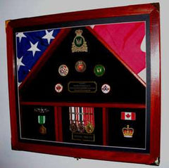 Framed collection of medals and badges against a backdrop of flags, representing honor and achievement.