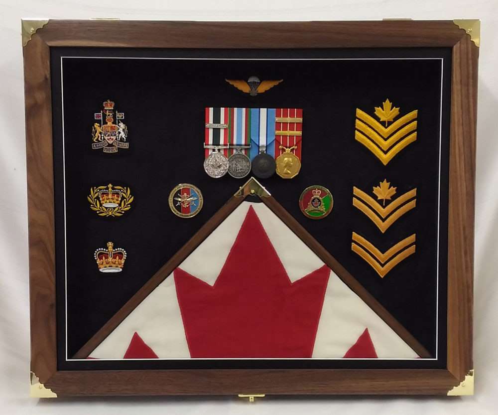 Veteran's memorabilia display featuring medals, badges, and a Canadian flag.