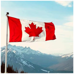 embroidered Canadian flag waving against a mountain backdrop under a clear blue sky.